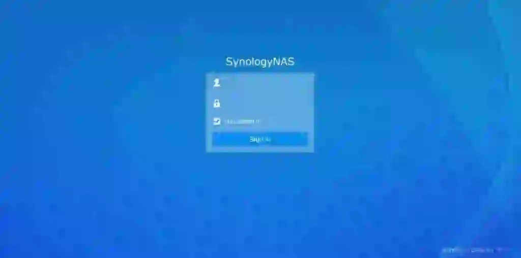 A person using a laptop to set up PhotoPrism on a Synology NAS with the Synology DSM interface visible on the screen