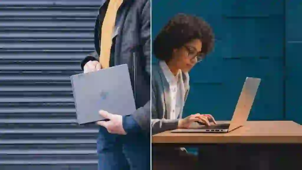 A person using a traditional laptop on a desk emphasizing the physical keyboard and trackpad